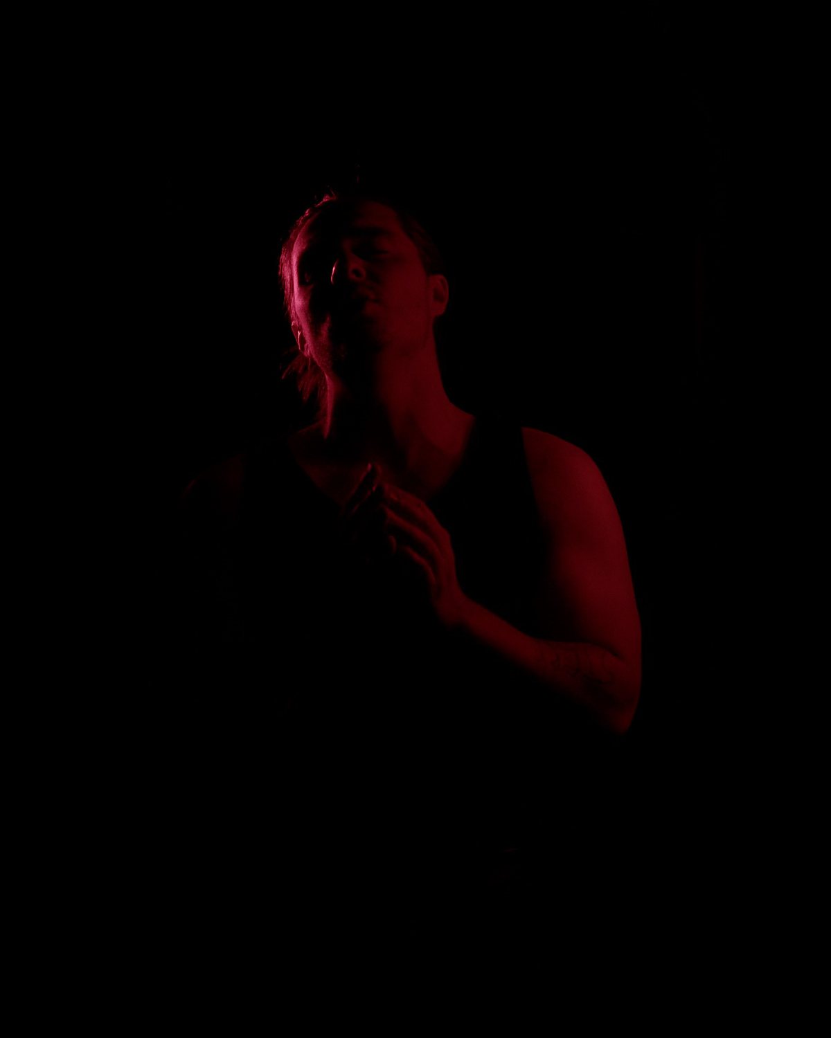Jay Putty in dramatic candlelit lighting